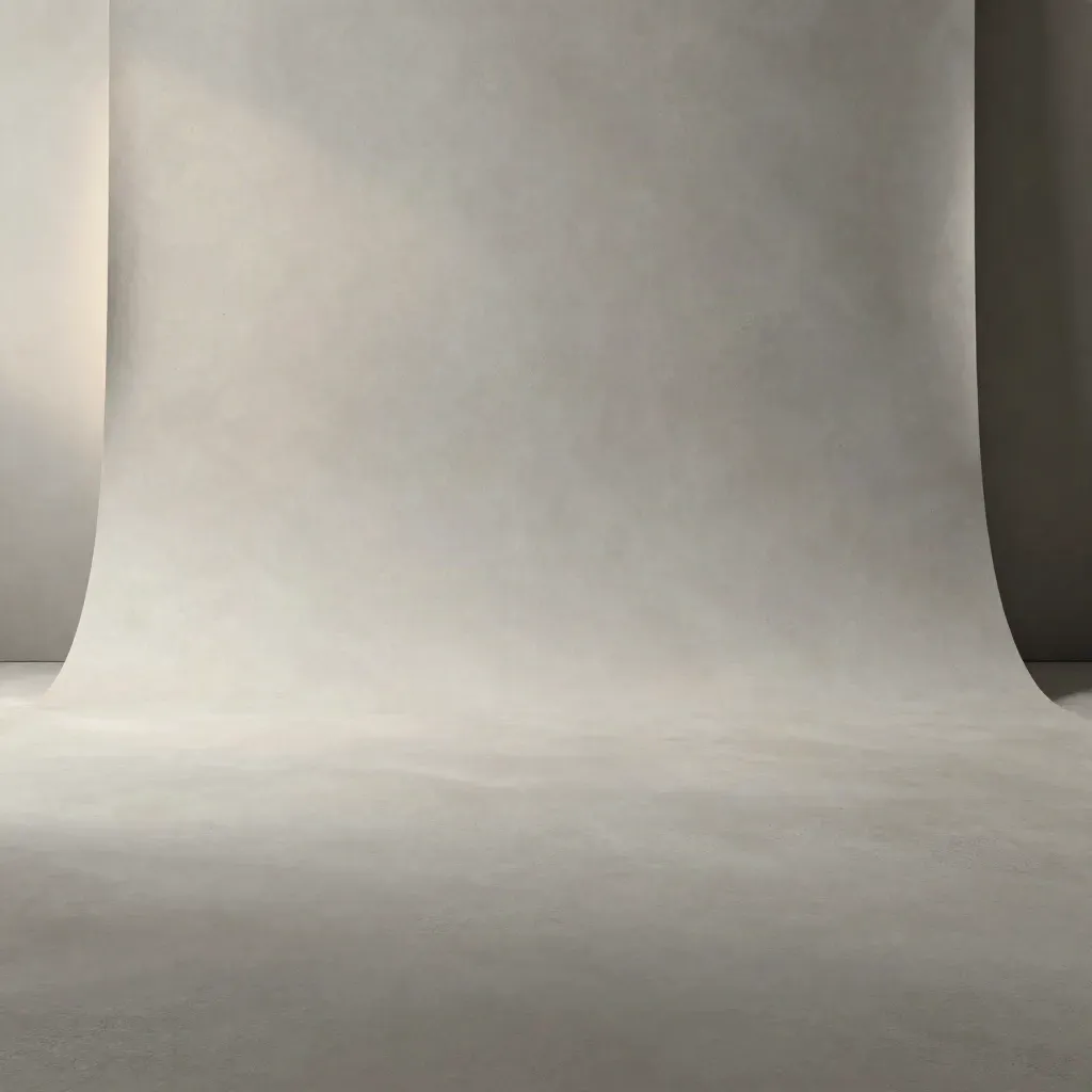 Empty pale concrete backdrop with soft grey gradient and subtle slate light for pricing cards.